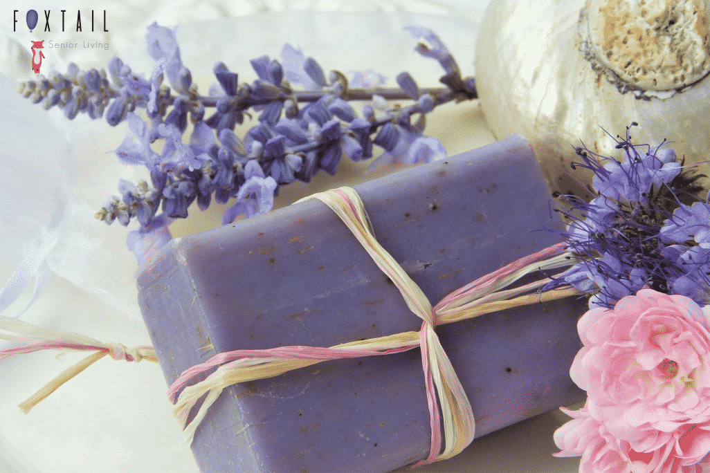a purple bar of soap with lavender around it.