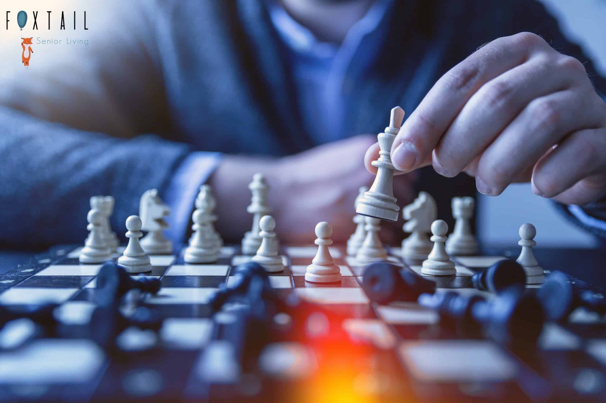 Selective focus of a person playing chess.