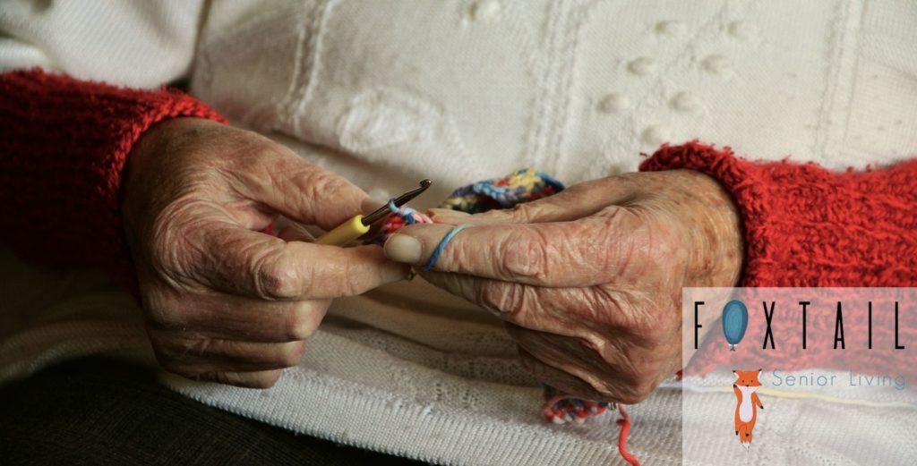 Elderly Woman Crocheting Yarn